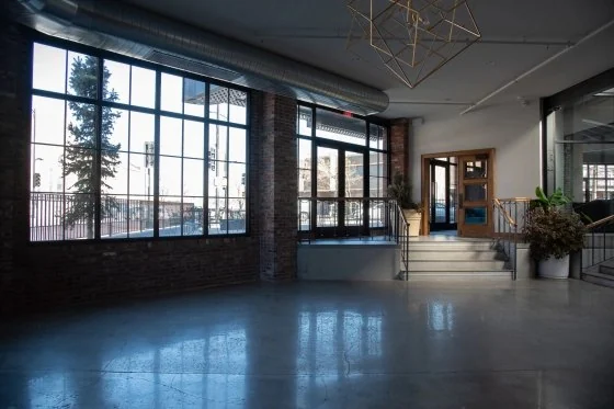 Entry with steel windows and stairs up to the original front door