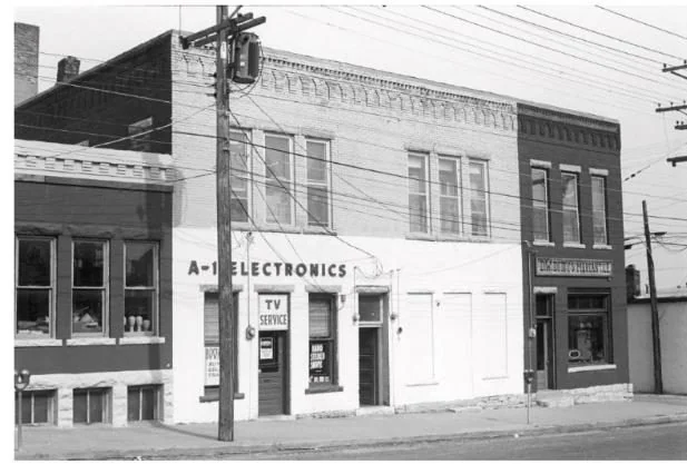 The building around 1979 with A-1 Electronics signage
